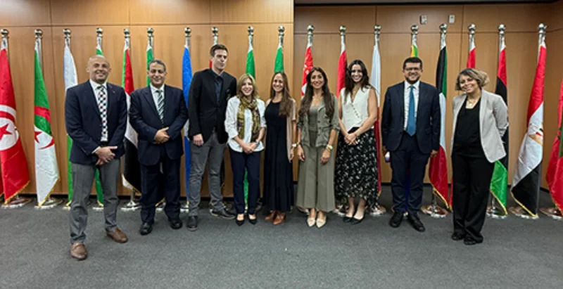 people standing in front of flags for a photo Marywood University and AASTMT Continue to Strengthen Global Academic Partnership