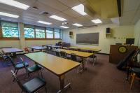 Four long desks with three chairs each fill a Marywood perfoming arts center classroom