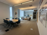 Couches and desks that fill the inside of the office of student success