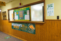 The outside of Marywood's Registar Office with the Pacer logo on multiple banners