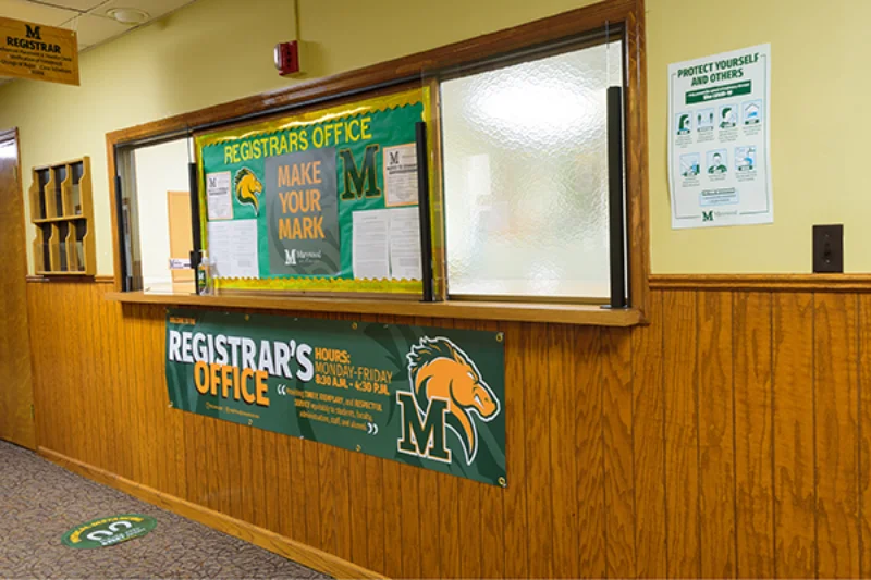 The outside of Marywood's Registar Office with the Pacer logo on multiple banners