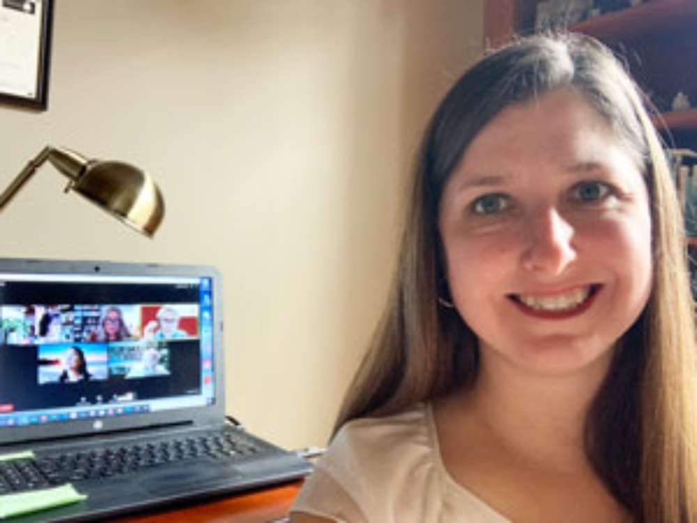 Janet Muse-Burke, Associate Professor, Psychology and Counseling Headshot with Computer Desk