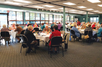 Circular tables with people enjoying a meal