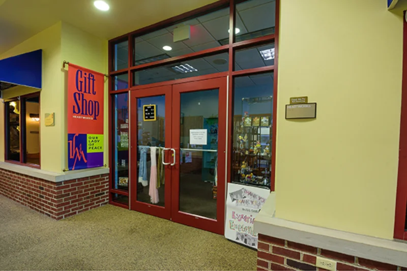 The entrance to the IHM gift shop with a red sign to the left