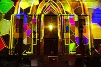 Multi-colored stained glass 3D lighting projection art on the front of the Liberal Arts Center Marywood University Celebrates Successful Completion of LIGHTING UP SCRANTON 2025