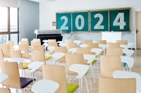 The back view of an empty classroom with 2024 written on the chalkboard. Marywood Launches a Suite of Academic Programs in 2024