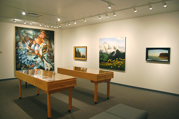 A room with paintings and other art exhibits