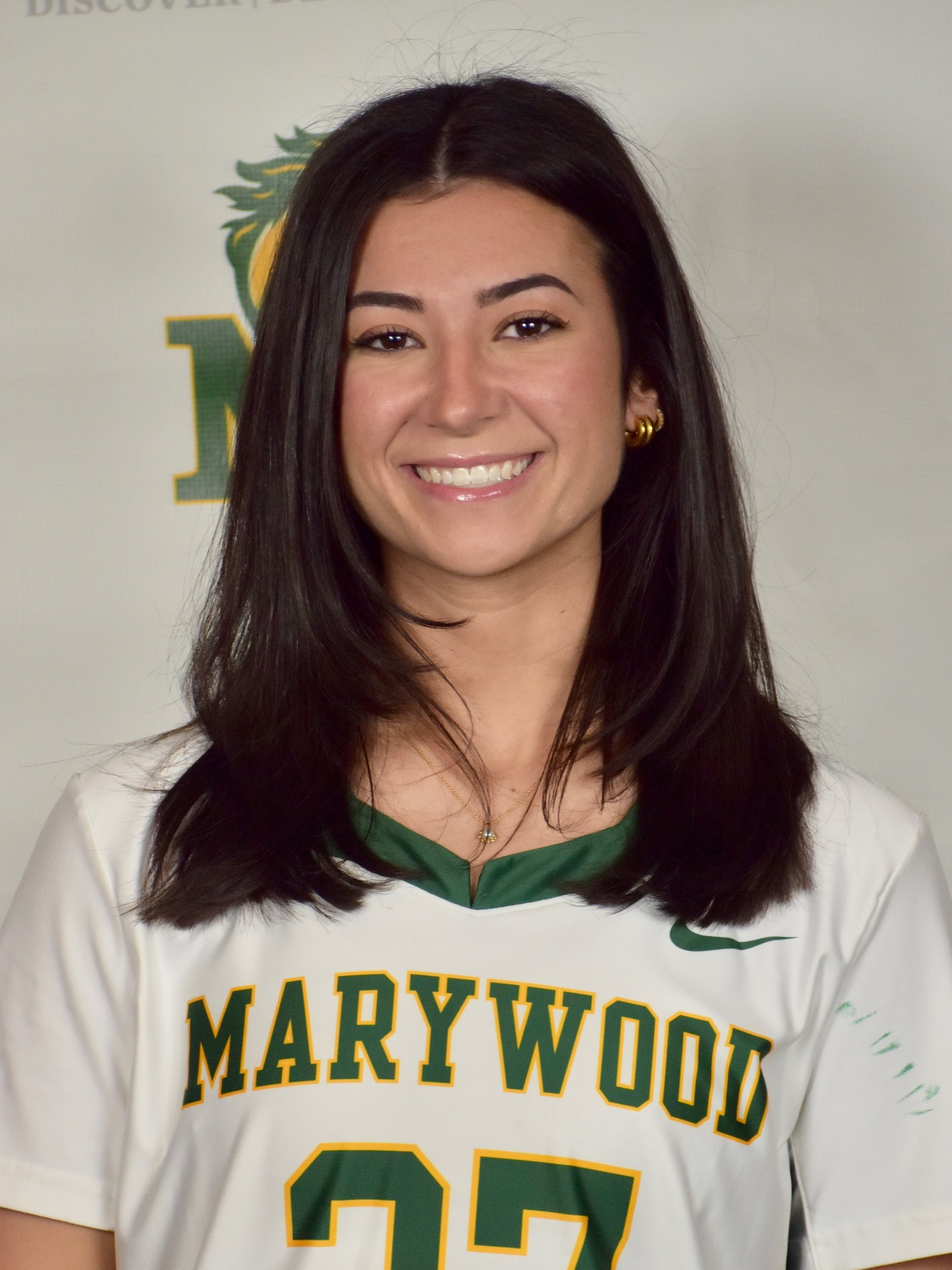 headshot of natalie yilanjian, a Marywood student, next to a pacer statue
