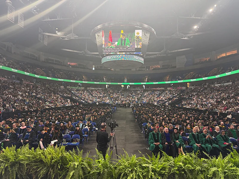 arena full of people in academic attire Marywood University Celebrates 108th Annual Commencement Ceremony