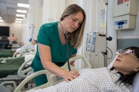 nursing student checking heartbeat on dummy using stethoscope Navigating Your Nursing Career: LPN to BSN Programs in Pennsylvania
