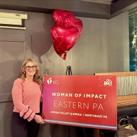 girl holding a sign Marywood’s Molly Clemente Leads Go Red for Women Woman of Impact Campaign