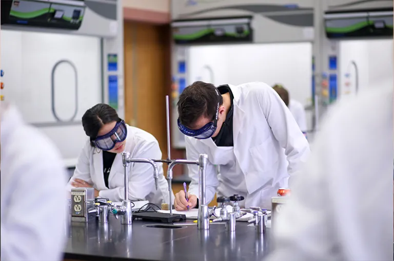 Two Marywood students working on a lab together