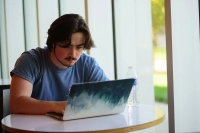 general student on a laptop What Type of Engineer Designs Buildings?