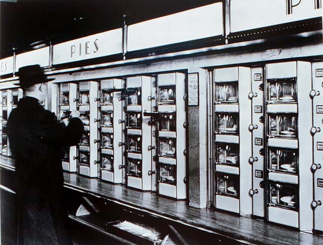 black and white photo of man looking at pie selection