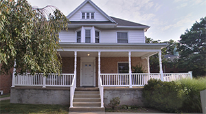 The front of Perpetual hall and its surrounding plant-life