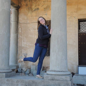 emily leaning on column posing for photo