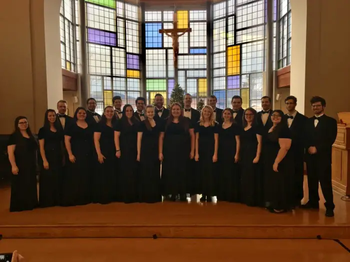 The 2016 Marywood chamber singers take a photo together on stage