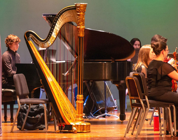 a photo of student, Jack Walsh, playing the piano