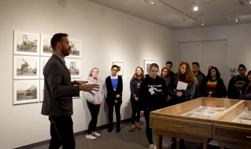 Gallery curator talking with students in Maslow gallery - video thumbnail
