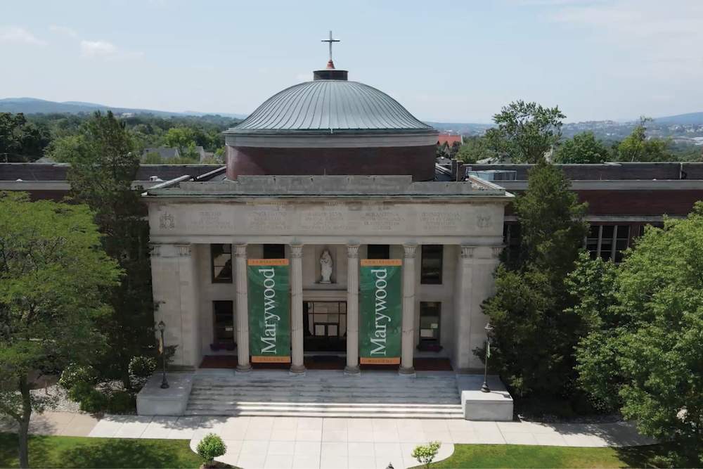 The front of the Marywood Liberal Arts Center with two Marywood banners hanging from it