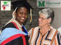 MLK Event Graduate with University President In Service to Others