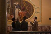 Students listen to a professor lecture on the art displayed in Marywood's Rotunda