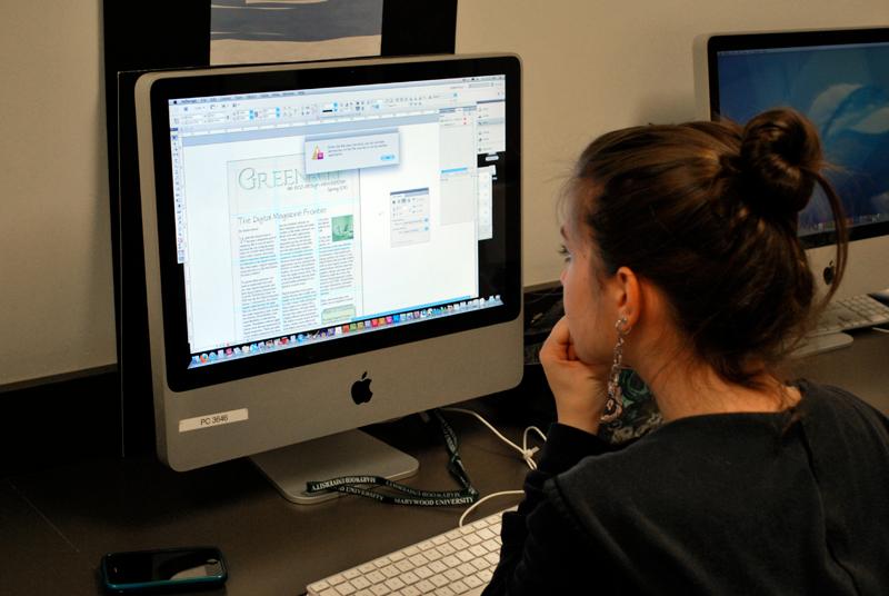 Marywood Graphic Design student working on a project on a University MAC