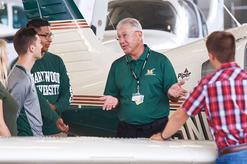 Capt. Joseph McDonald, director of the Marywood Aviation Program and assistant professor of aviation, with aviation students. Aviation Program Partners with FlyGATEWAY Aviation Institute