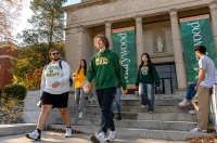 Various students walking down the stone steps in front of  the Liberal Arts Center building with Roman columns and Marywood banners. Marywood University’s Quality and Value Recognized by “Best Colleges”