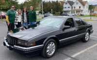 Marywood students stand near a car that was featured in the recent Crusin' for a Cause Car Show.