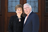 Jim and Cathy Gavin standing next to each other in front of door