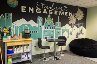 Wall art of Scranton and Marywood colored in green and gold with the text 'student engagement' above
