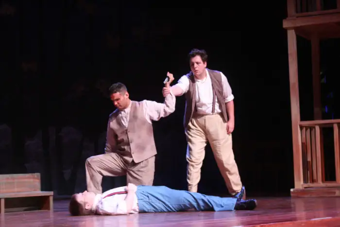Three Marywood students acting on stage