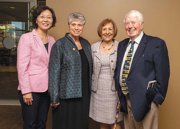 Sister Mary and others smile for a picture